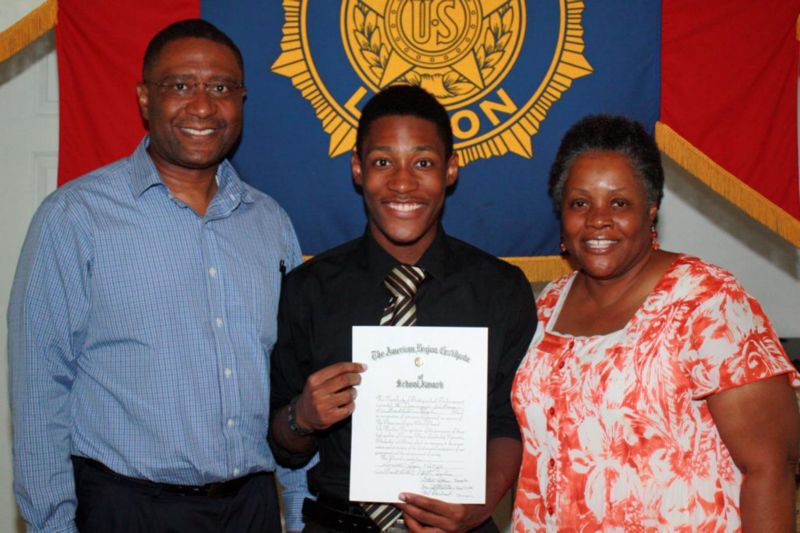 Dominique Williams with his parents